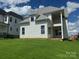 Backyard view of the house featuring a manicured lawn at 7459 Fighting Creek Rd # 33, Sherrills Ford, NC 28673