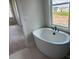 Relaxing bathroom features soaking tub next to a large window with sleek fixtures at 7459 Fighting Creek Rd # 33, Sherrills Ford, NC 28673