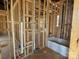 Bathroom in progress, framing complete with tub installed, showing plumbing and layout details at 7459 Fighting Creek Rd # 33, Sherrills Ford, NC 28673