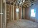 Bedroom framing in progress showcases initial construction details and window placement at 7459 Fighting Creek Rd # 33, Sherrills Ford, NC 28673