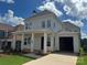 Inviting two-story home showcasing a charming front porch with classic white columns at 7459 Fighting Creek Rd # 33, Sherrills Ford, NC 28673