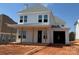 Charming two-story home with white siding, inviting front porch, and an attached garage on a sunny day at 7459 Fighting Creek Rd # 33, Sherrills Ford, NC 28673