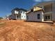 New home exterior showing white siding, gray roof, porch under construction on dirt lot at 7459 Fighting Creek Rd # 33, Sherrills Ford, NC 28673