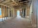 Open-concept living room shows framing and construction progress, with natural light and layout at 7459 Fighting Creek Rd # 33, Sherrills Ford, NC 28673