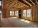 Living room under construction with a fireplace and multiple windows at 7459 Fighting Creek Rd # 33, Sherrills Ford, NC 28673