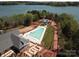 Aerial view of community pool, amenity center, and landscaping near the lake, offering an attractive lifestyle at 7459 Fighting Creek Rd # 33, Sherrills Ford, NC 28673