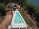 Aerial view of community pool and landscaping, a beautiful amenity for residents to enjoy at 7459 Fighting Creek Rd # 33, Sherrills Ford, NC 28673