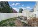 Enjoy outdoor living in this backyard with a privacy fence and storage shed on a sunny day at 8004 Sapwood Ct, Matthews, NC 28104