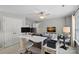 A versatile room featuring a sofa, workspace with monitors, and a neutral color scheme at 9117 Spratt Ln, Waxhaw, NC 28173