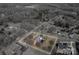 Aerial view of home featuring a large, private backyard with a swimming pool surrounded by mature trees at 102 3Rd Se Ave, Catawba, NC 28609