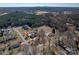 A view of a home and surrounding neighborhood with trees and outdoor space at 102 3Rd Se Ave, Catawba, NC 28609