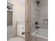 A bathroom features a tiled shower, white vanity with granite top and access to the bedroom at 102 3Rd Se Ave, Catawba, NC 28609