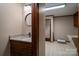 Bathroom with a granite-look vanity and tile flooring next to the sink and shower at 102 3Rd Se Ave, Catawba, NC 28609