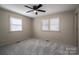 A bedroom features neutral walls, carpet, and windows for natural light at 102 3Rd Se Ave, Catawba, NC 28609