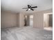 A spacious bedroom features neutral walls, carpet and a ceiling fan for optimal comfort at 102 3Rd Se Ave, Catawba, NC 28609