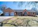 Charming brick home featuring an attached two-car garage and manicured front lawn at 102 3Rd Se Ave, Catawba, NC 28609
