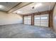 Spacious garage with two white garage doors and overhead lighting, providing ample parking and storage at 102 3Rd Se Ave, Catawba, NC 28609