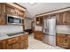 Kitchen featuring stainless steel refrigerator, granite counters and white tile floors at 102 3Rd Se Ave, Catawba, NC 28609