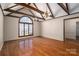 Bright living room featuring hardwood floors, exposed beams, and a large picture window at 102 3Rd Se Ave, Catawba, NC 28609