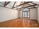 Bright living room featuring hardwood floors, exposed beams, and a large picture window at 102 3Rd Se Ave, Catawba, NC 28609