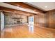 Living room with stone fireplace, wood beams, hardwood floors, and natural light at 102 3Rd Se Ave, Catawba, NC 28609