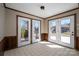 Bright sun room with tiled floor, paneled walls, and access to the outdoors at 102 3Rd Se Ave, Catawba, NC 28609