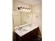 Bathroom with a double vanity and a large wall mirror at 1146 Crestmont Se Dr, Concord, NC 28025