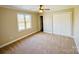 Neutral bedroom with natural light and a double door closet at 1146 Crestmont Se Dr, Concord, NC 28025