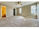 Spacious bedroom with plush carpeting and natural light at 1146 Crestmont Se Dr, Concord, NC 28025