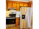 Modern kitchen featuring stainless steel appliances and wood cabinetry at 1146 Crestmont Se Dr, Concord, NC 28025