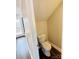 Compact powder room with a white toilet and modern design, maximizing space at 1146 Crestmont Se Dr, Concord, NC 28025