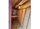 Interior view of the shed showcasing shelving and electrical panel for storage at 1146 Crestmont Se Dr, Concord, NC 28025