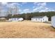 Large backyard with a storage shed and various structures, providing plenty of room for activities at 11918 Crabapple Ln, Huntersville, NC 28078