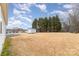 Expansive backyard featuring a storage shed and mature trees, offering ample outdoor space at 11918 Crabapple Ln, Huntersville, NC 28078