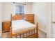 Bedroom with wood furniture including bed and dresser in a naturally lit space at 11918 Crabapple Ln, Huntersville, NC 28078