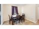 Dining room featuring a table with six chairs and a window with lovely curtains at 11918 Crabapple Ln, Huntersville, NC 28078