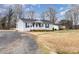 Quaint single-story home with a white picket fence, complimented by a large front yard at 11918 Crabapple Ln, Huntersville, NC 28078