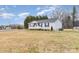 Well-maintained single-story home featuring a charming white picket fence and a spacious lawn at 11918 Crabapple Ln, Huntersville, NC 28078