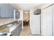 Kitchen showcases blue cabinets, countertops, appliances, and access to the dining room at 11918 Crabapple Ln, Huntersville, NC 28078