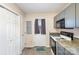 Well-lit kitchen features blue cabinets, a door to the outside, and modern appliances at 11918 Crabapple Ln, Huntersville, NC 28078
