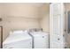 Bright laundry room equipped with a modern washer and dryer set at 11918 Crabapple Ln, Huntersville, NC 28078