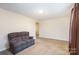 Neutral living room with carpet, and space for personalization; offering a comfortable setting at 11918 Crabapple Ln, Huntersville, NC 28078