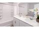 Bright bathroom featuring a tub and double vanity with white countertops and cabinetry at 1348 Secrest Commons Dr, Monroe, NC 28112