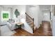 Bright living room with staircase and view of the front entrance at 1348 Secrest Commons Dr, Monroe, NC 28112