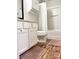 Bathroom features white cabinets, a toilet, and a shower-tub combo with white shower curtain at 140 Marakery Rd # C, Mooresville, NC 28115