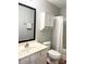 Traditional bathroom featuring a vanity, mirror, storage cabinet, and a shower with a white shower curtain at 140 Marakery Rd # C, Mooresville, NC 28115