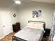 Bedroom features a comfortable bed, wood floors, and neutral decor at 140 Marakery Rd # C, Mooresville, NC 28115