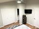 Bedroom features a closet, TV, wood floors, and ample storage at 140 Marakery Rd # C, Mooresville, NC 28115