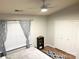 Bright bedroom showcasing wood floors, a large window, and ample closet space at 140 Marakery Rd # C, Mooresville, NC 28115