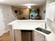 Well-lit kitchen overlooking the living area, with stainless steel appliances and a breakfast bar at 140 Marakery Rd # C, Mooresville, NC 28115